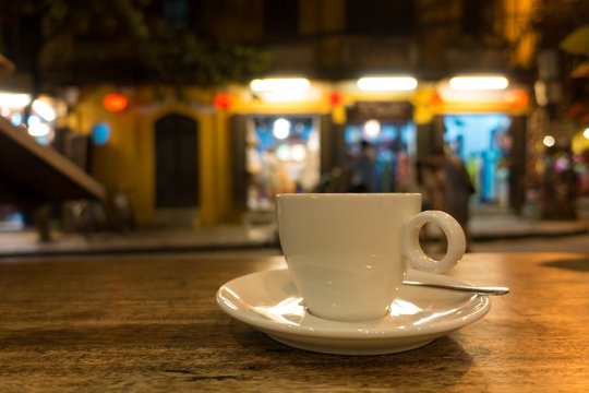 
A cup of capuchino coffee in night. Royalty high quality free stock image of a cup of capuchino coffee in a coffee shop. Evening coffee is easy to lose sleep