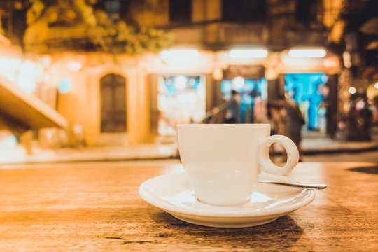 
A cup of capuchino coffee in night. Royalty high quality free stock image of a cup of capuchino coffee in a coffee shop. Evening coffee is easy to lose sleep