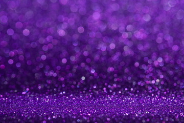 Abstract purple sparkling glitter wall and floor perspective background studio with blur...