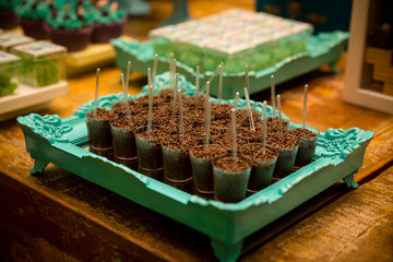Brazilian sweets called brigadeiro, distributed on party table to be consumed