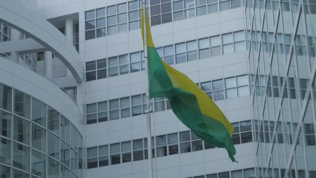 Slow motion close shot of the flag of The Hague at the city hall. Shot in sixty frames per second on a twenty five frames variable frame rate.