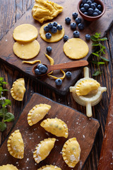 Fototapeta premium dumpling, pierogi, vareniki with blueberry fillings