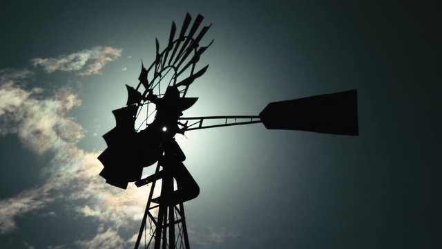 Western Metal Windmill in the sun, aermotor style / lens flare