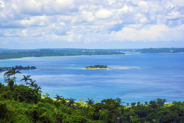 Fototapeta na wymiar Ocean view from the hilltop with a small island.