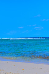 Fototapeta na wymiar Tropical waters with clear blue sky.