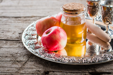 Honey Jar and Apples on beautiful tray on wooden table background. Jewish Holiday Rosh Hashanah Concept