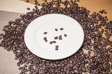 coffee beans with a white dish