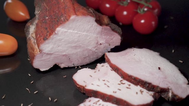 Slices of smoked meat falls in slow motion