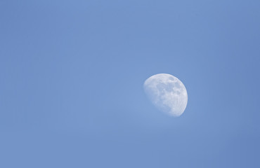 white moon on a blue sky during daytime