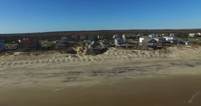 Drone shot from over the ocean of beach houses Nags Head, North Carolina.