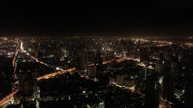 Timelapse of skyline with distant lightning in Bangkok Thailand