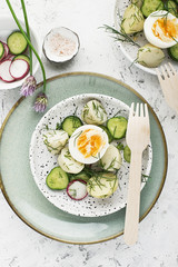 Potato salad farmer market with fresh vegetables cucumber, radish and organic eggs with dill and chives onions. Top View.