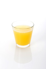 orange juice with a glass cup isolated white.