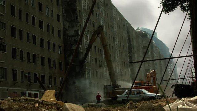 Timelapse of crane demolishing building in Beijing China