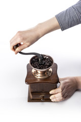 woman hand with coffee grinder isolated white. 