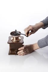 Fototapeta na wymiar woman hand with coffee grinder isolated white. 