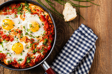 Shakshouka, dish of eggs poached in a sauce of tomatoes, chili peppers, onions