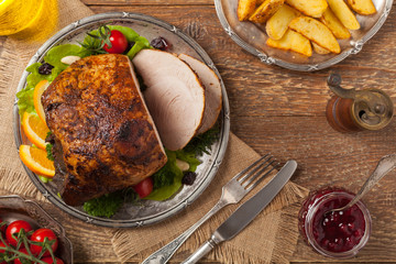 Baked ham, served on an old plate.