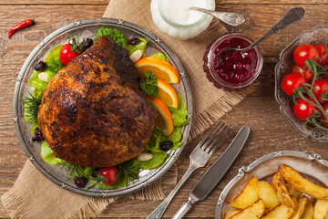 Baked ham, served on an old plate.