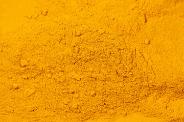 Close up of Turmeric powder texture background