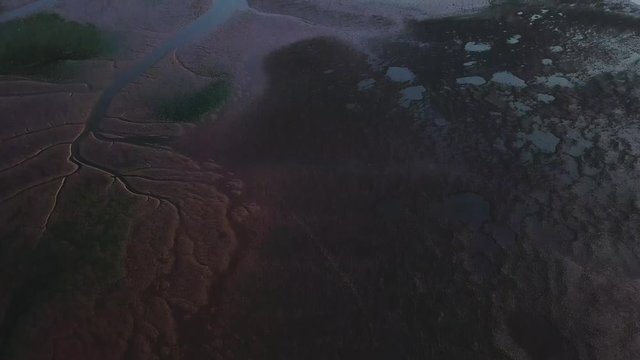 Flying towards land off of the beach of Lympstone in southwest England. Lympstone is a coastal town with a lot of history and many tourists.