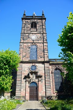 Saint Modwens Church tower with an English flag atop, Burton upon Trent, UK.