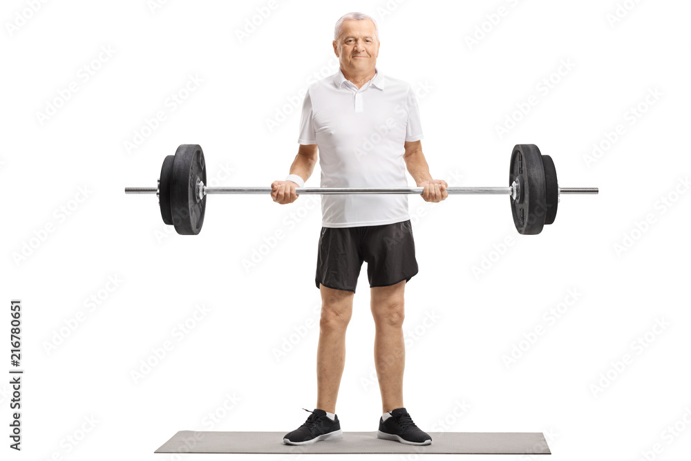 Sticker Senior standing on an exercise mat and lifting a barbell