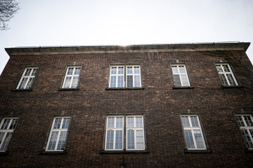 Beautiful old window on a brick wall background of an old house.
