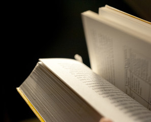 Fototapeta premium Flipping Through Pages Of Book With Motion Blur