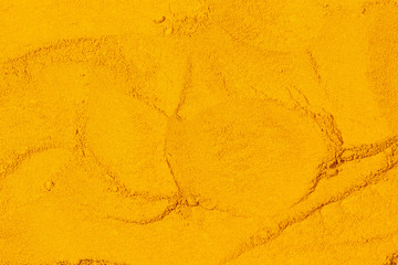 Close up of Turmeric powder texture background