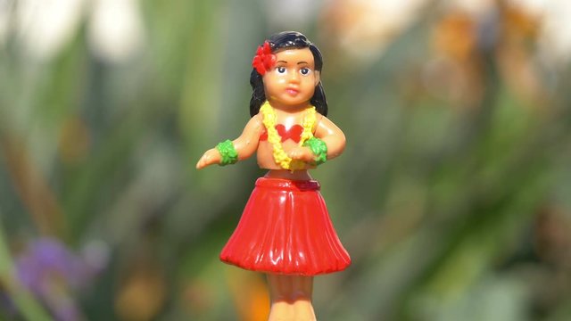 Traditional hula dancer souvenir toy in 4K slow motion 60fps