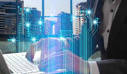 Double exposure of Businessman hand use laptop with interface of digital network connection
