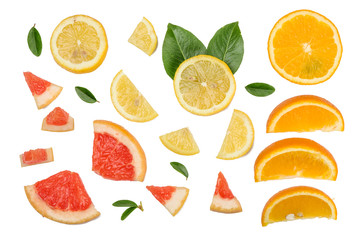 Sliced pieces of grapefruit, orange, lemon isolated on white, top view