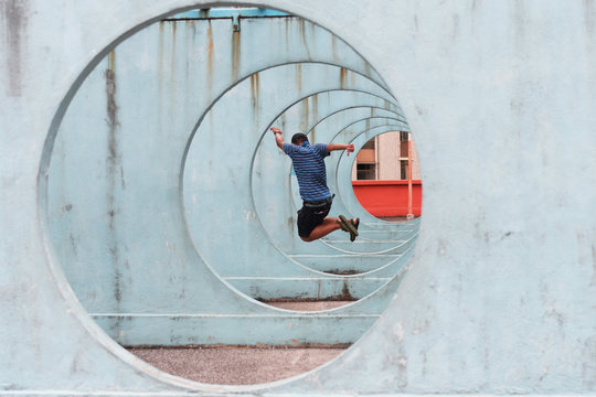 A young man is enjoy traveling on new hipster landmark building in Hong Kong.