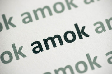 word amok printed on paper macro