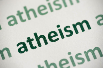 word atheism printed on paper macro