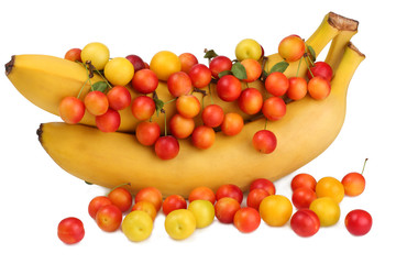 Bananas and plums isolated on white