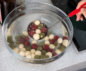 The cooking step of making Japanese Dango dessert with 3 different color in pink(red), white, and green, recipe, hanami Dango, tsukimi Dango, copy space