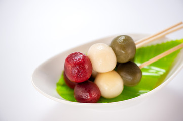 Japanese Dango dessert with 3 different color in pink(red), white, and green, recipe, hanami Dango, tsukimi Dango, copy space.