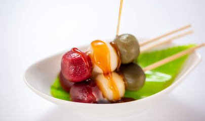 Japanese Dango dessert with 3 different color in pink(red), white, and green, recipe, hanami Dango, tsukimi Dango, copy space.