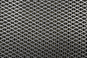 Steel mesh. Grid of car air filter. Metal grill texture of vehicle air filter.