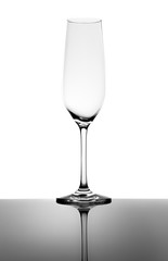 Empty Champagne Glass and Reflection Isolated on White
