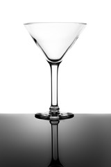 Empty Martini Glass and Reflection Isolated on White