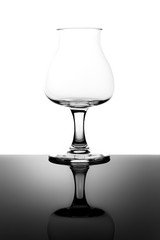 Empty Tasting Beer Glass with Stem and Reflection Isolated on White