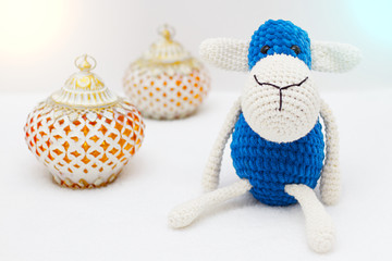 Greeting card on white background. Eid Al Adha sacrifice festival, Islamic Arabic candle and blue sheep