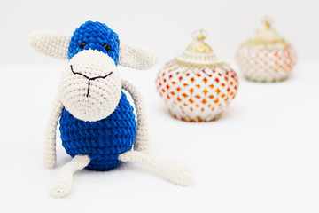 Greeting card on white background. Eid Al Adha sacrifice festival, Islamic Arabic candle and blue sheep