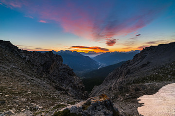 Fototapeta na wymiar The Alps at sunrise. Colorful sky majestic peaks, dramatic valleys, rocky mountains. Expansive view from above.
