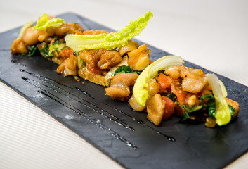 Hot salad with poultry meat and vegetables
