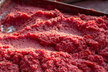 Tomato paste making process of angled shot under afternoon sun