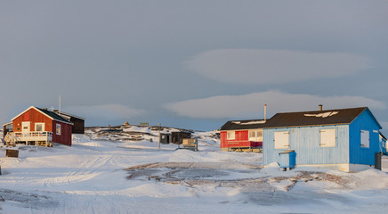 Colourful houses in the tiny Inuit village of Oqaatsut in west Greenland